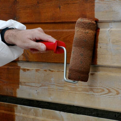Textrol being applied to a garden shed