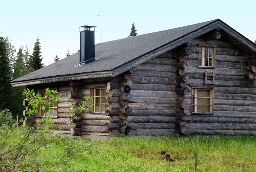 Log cabin in a field Log cabin in a field