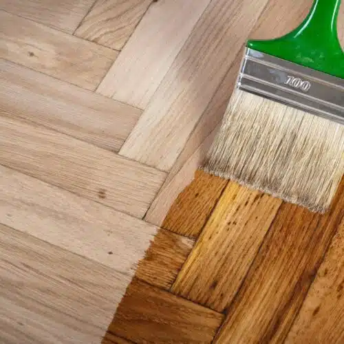 varnish being applied to hardwood flooring
