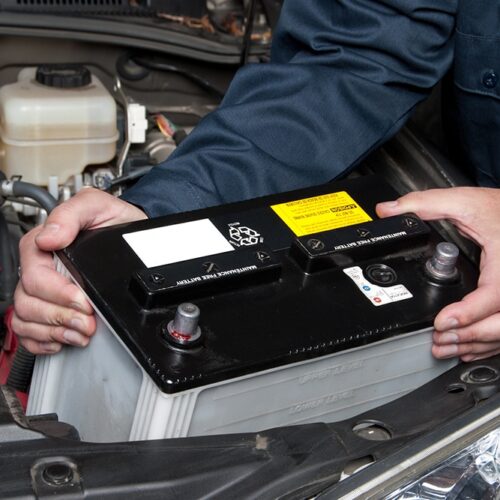 Man replacing a car battery