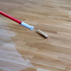 Flooring being finished with wood oil