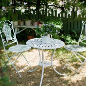 White painted metal table and chairs