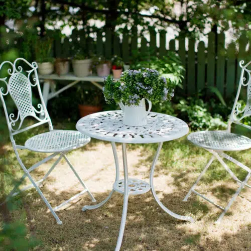 White painted metal table and chairs