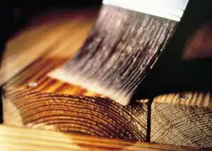 Close up of Seasonite being applied to new wood