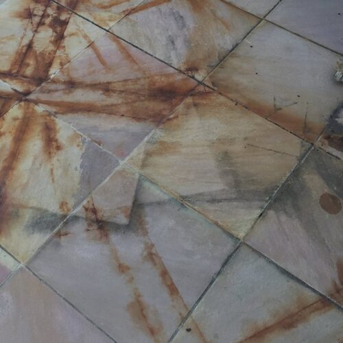 rust on tiles before - close up