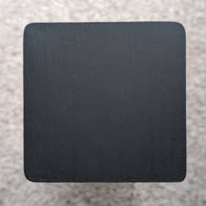 Black Decking Paint swatch - applied to new pine wood in natural lighting.