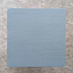 Blue Grey Decking Paint swatch - applied to new pine wood in natural lighting.