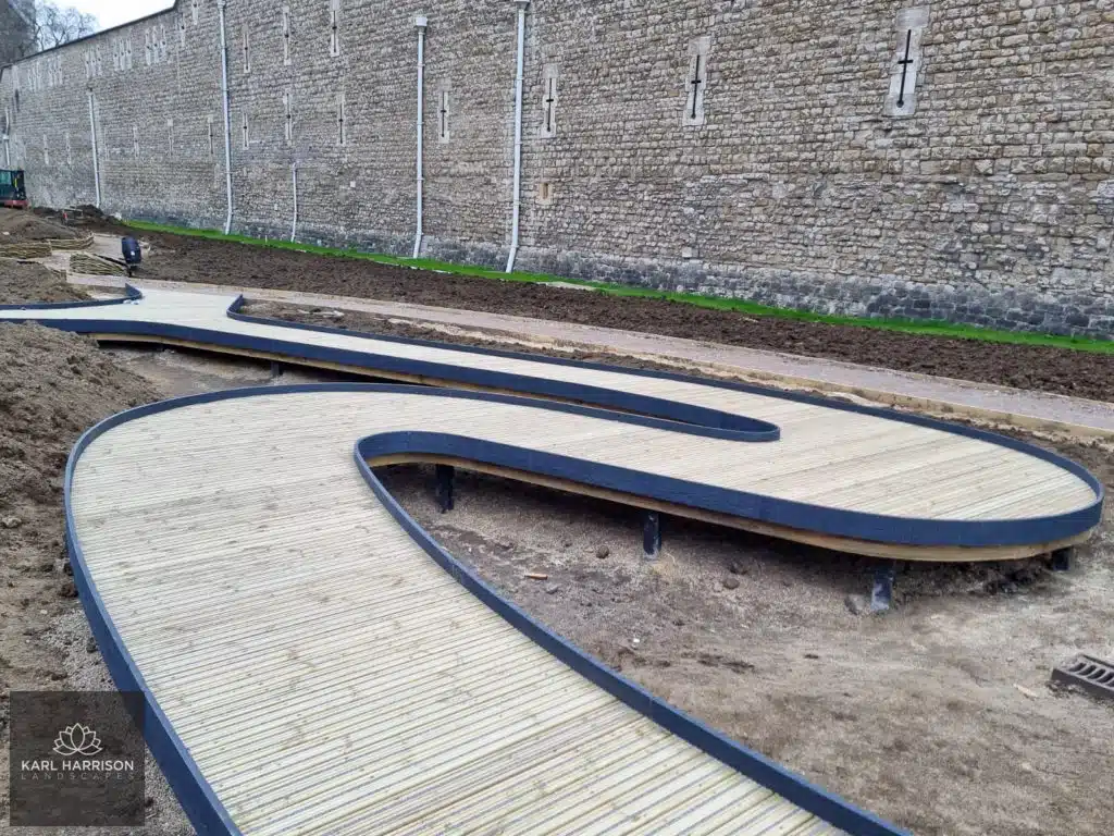 Close up of the curved deck being installed at the London Superbloom. Image credit to Karl Harrison Landscapes.